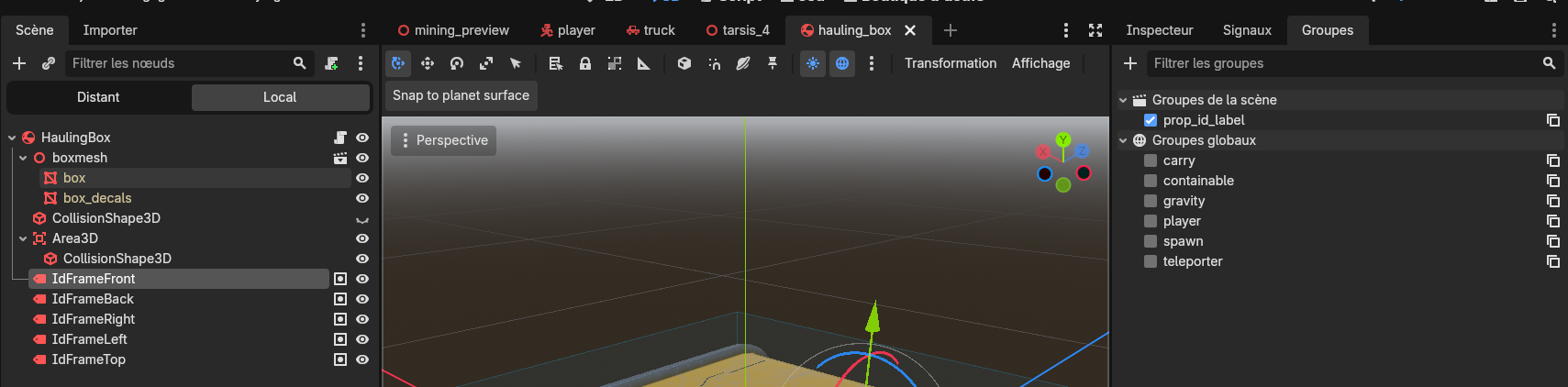 The hauling box scene tree in Godot with five IdFrame Label3D nodes, and the Groups panel showing the selected frame belongs to the prop_id_label group
